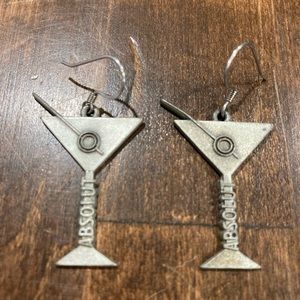 “Absolute Vodka” martini, and olive earrings.